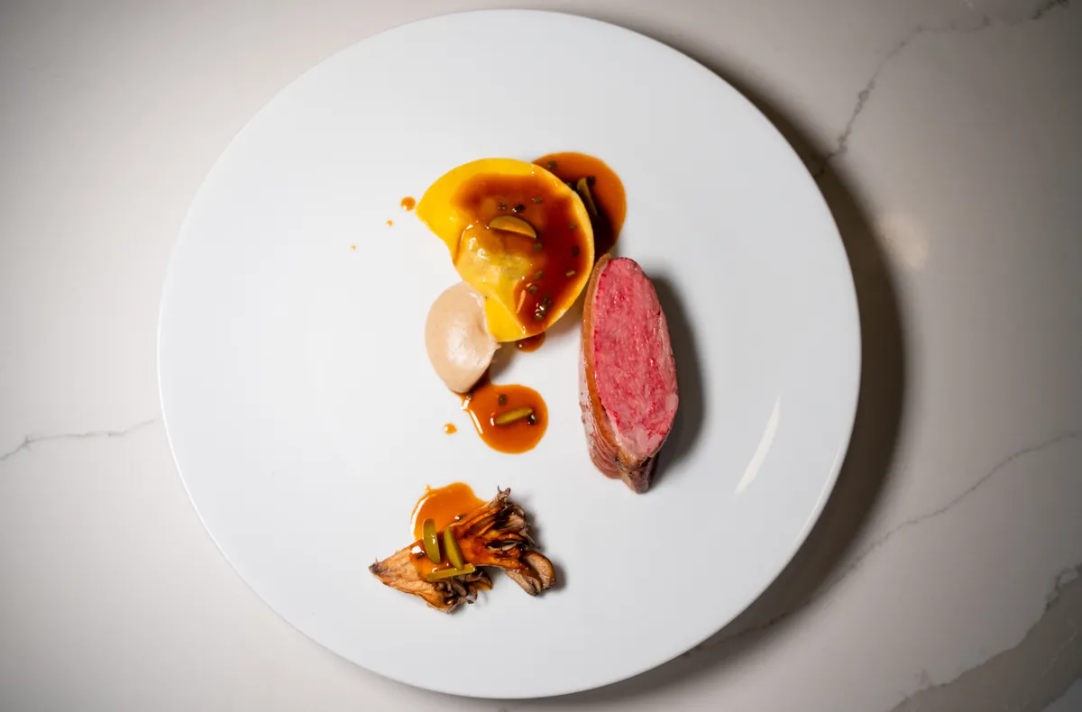 Roasted duck breast with filled pasta, maitake mushroom, and jus
