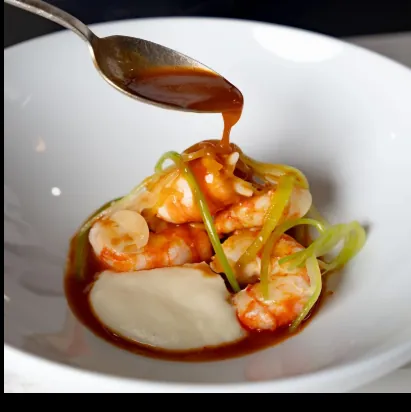 Prawns with sauce poured tableside