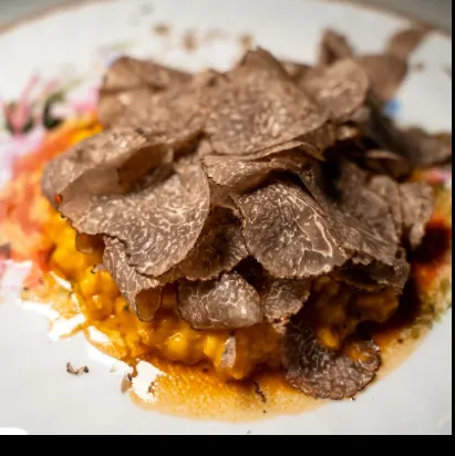 Shaved black truffle over corn — The Lounge